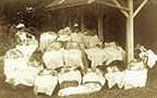 Photograph of babies and nurses at a Karitane Hospital.
